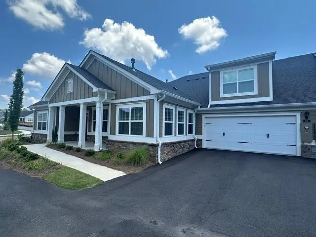 Large Covered Porch and 2 Car Garage