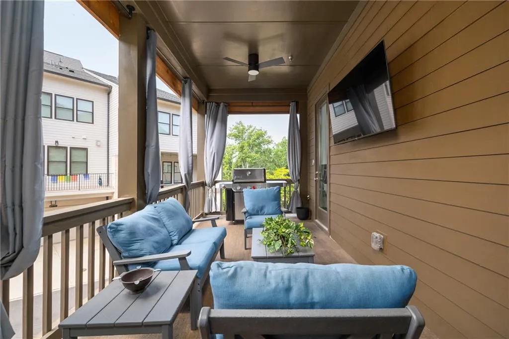 Covered deck off the kitchen; super private; includes outdoor TV and room for a grill