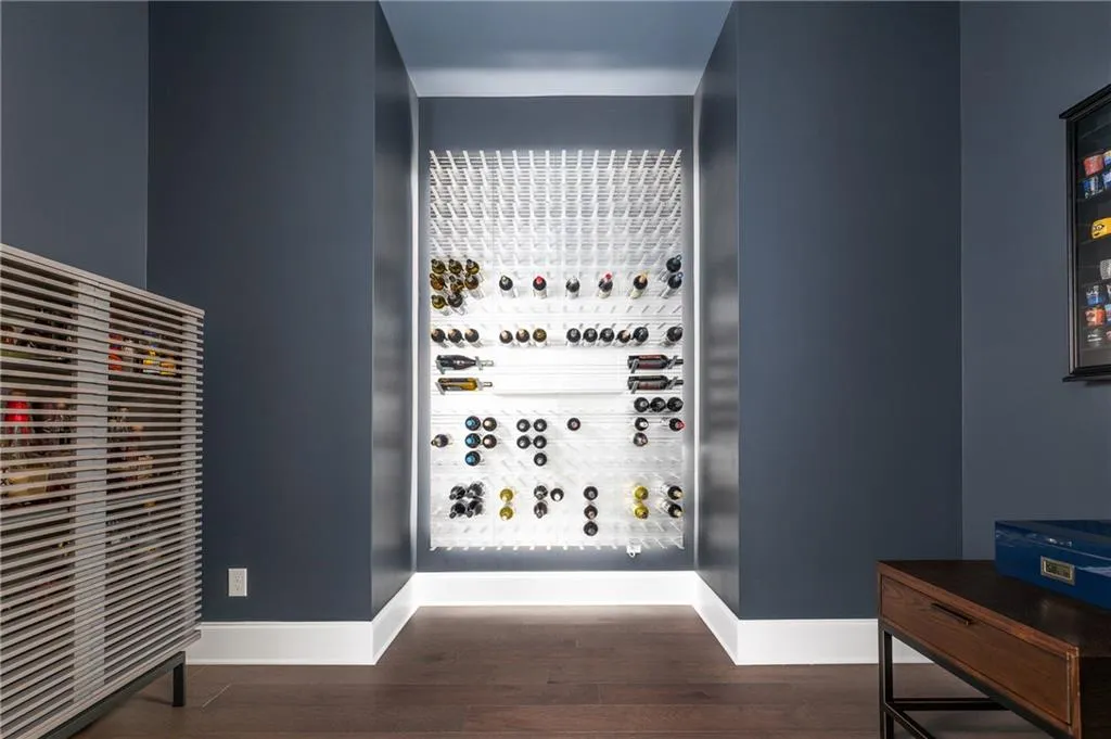 Custom wine room with plenty of room to add seating; all on the main floor