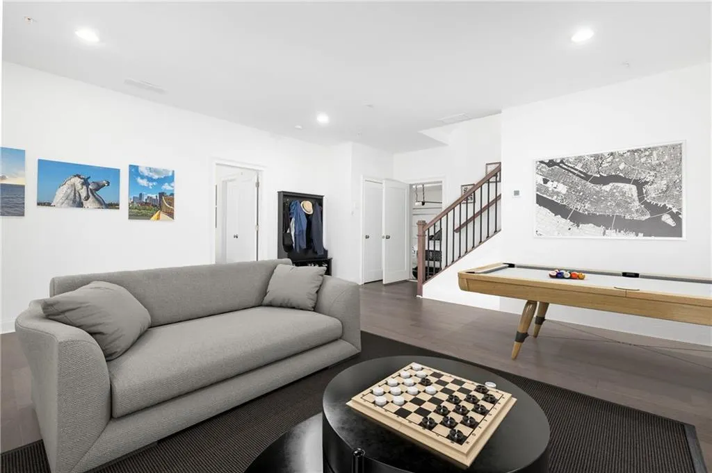 Virtually staged garage level media room to show potential