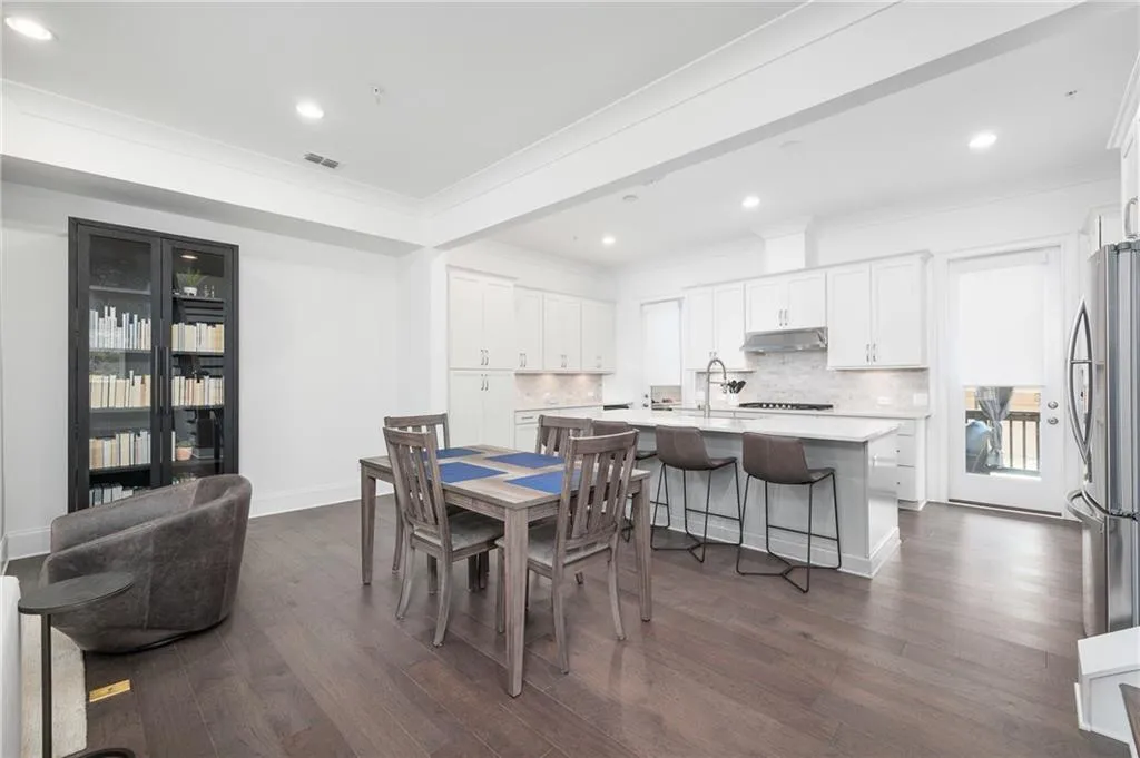 Open concept dining area has space large enough for a table to seat 12+