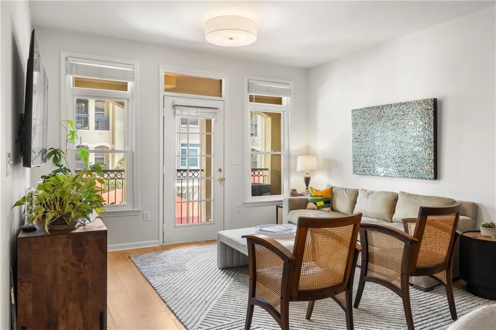 Sitting room with light wood-type flooring and baseboards