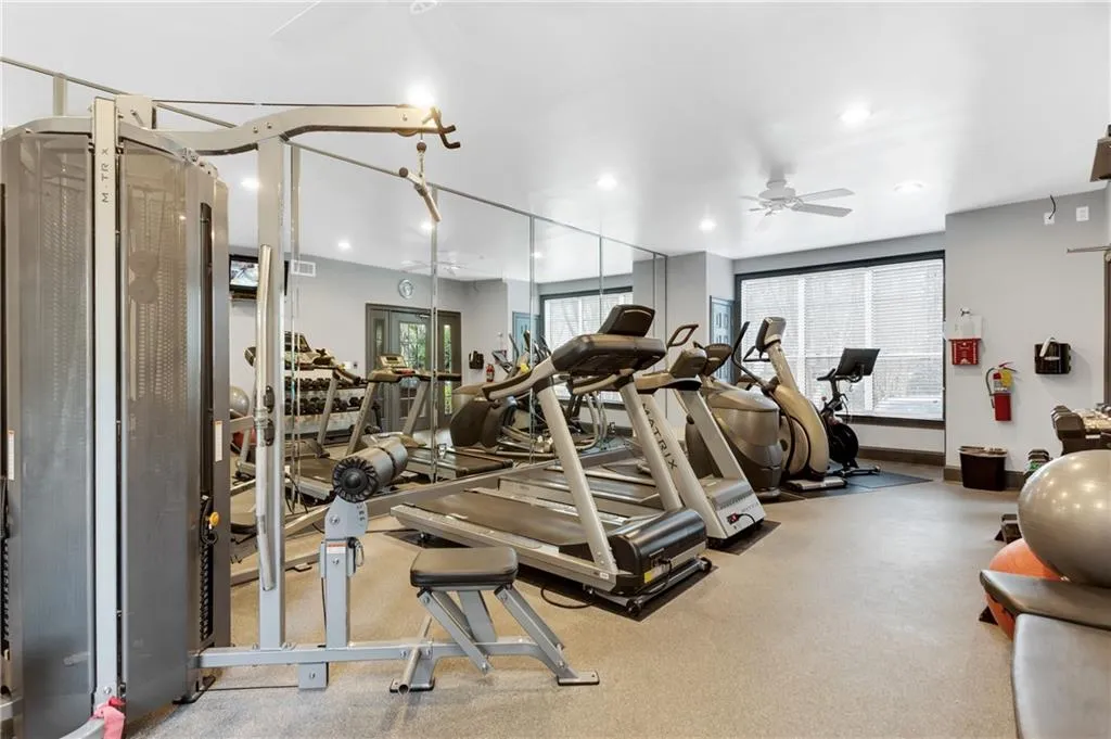 Gym featuring recessed lighting, carpet floors, and ceiling fan