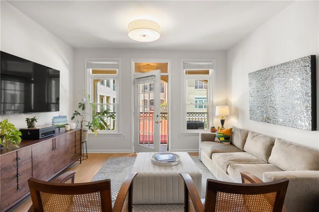 Sitting room featuring light wood-type flooring and baseboards