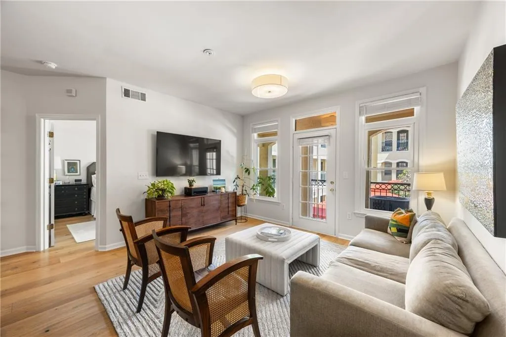 Living room with light wood-style floors and baseboards
