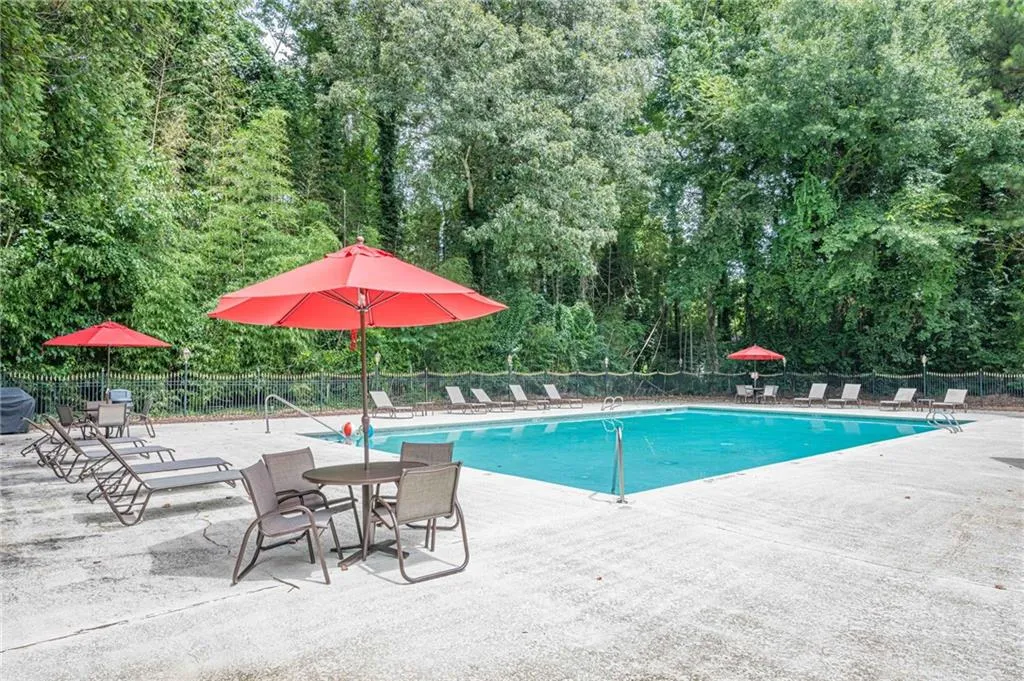 Community pool with a patio area
