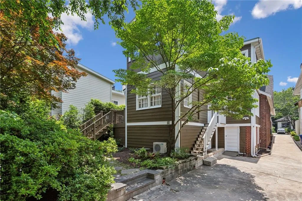 One car parking pad to right of neighbors garage