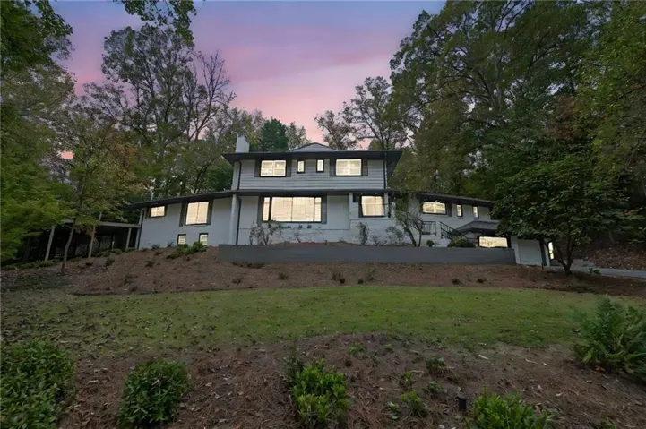 White exterior with dark trim and multiple windows