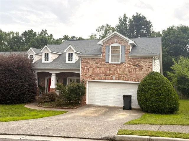 Brick and siding exterior with a multi-level roofline