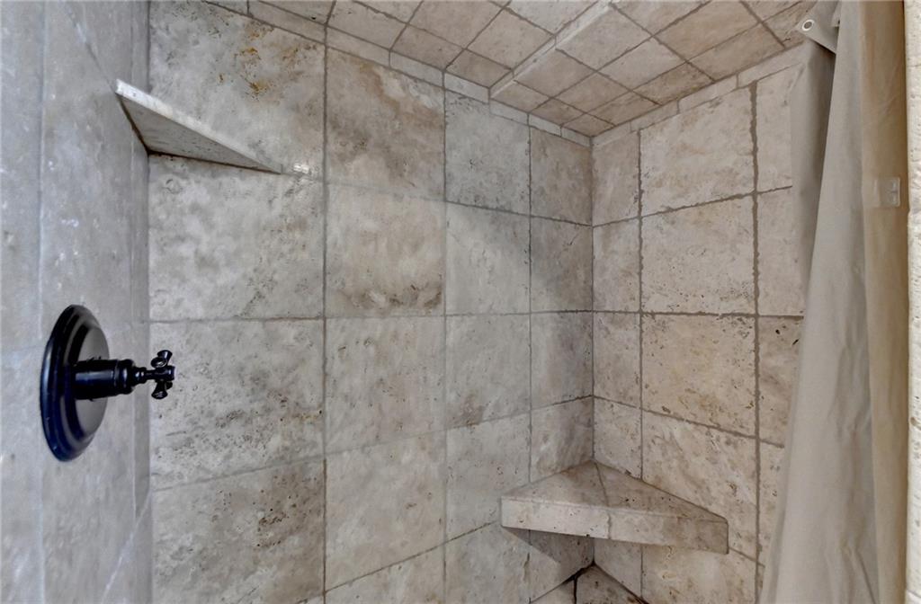 Details with a shower with curtain