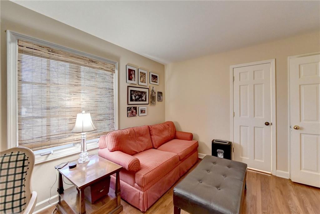 Living room with light hardwood / wood-style floors