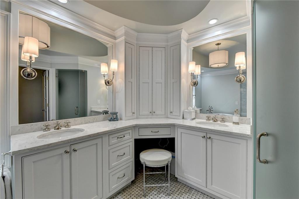 Bathroom featuring vanity, crown molding, and tile floors