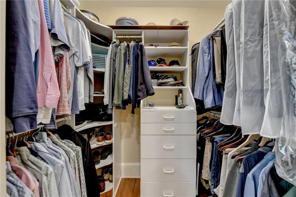 Spacious closet featuring light hardwood / wood-style floors