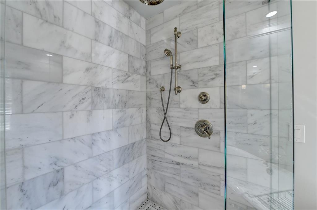 Bathroom featuring tiled shower