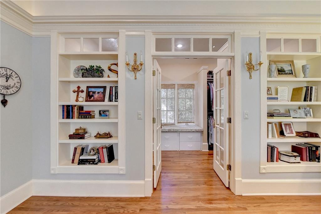 Hallway featuring light hardwood / wood-style flooring and built in features