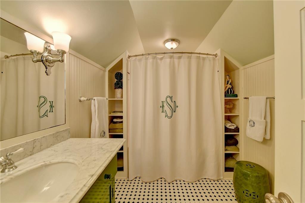 Bathroom with vaulted ceiling and vanity
