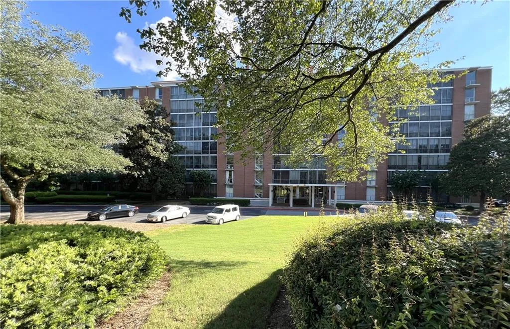 View of property's community with a lawn
