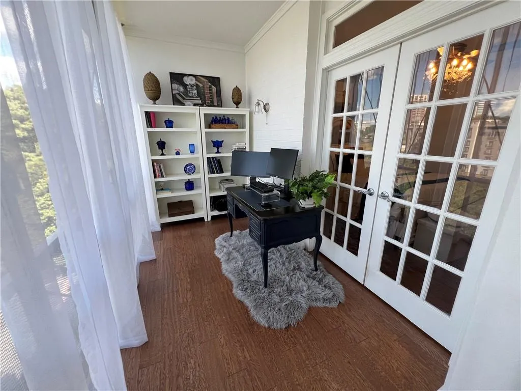 Sunroom with French doors off bedroom. Perfect for office, exercise room, or sitting area