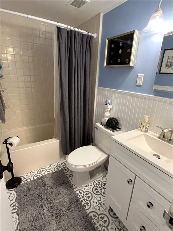 Sparkling bath with new vanity, new lighting, new flooring & bead board wall