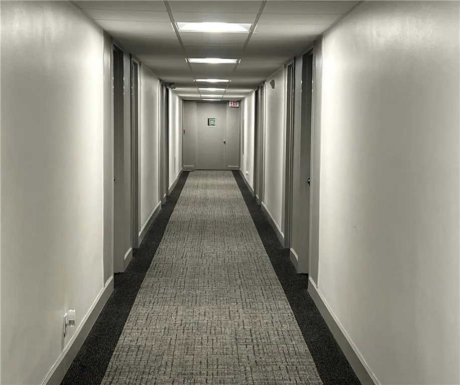 Brand new paint and carpet in hallways of building