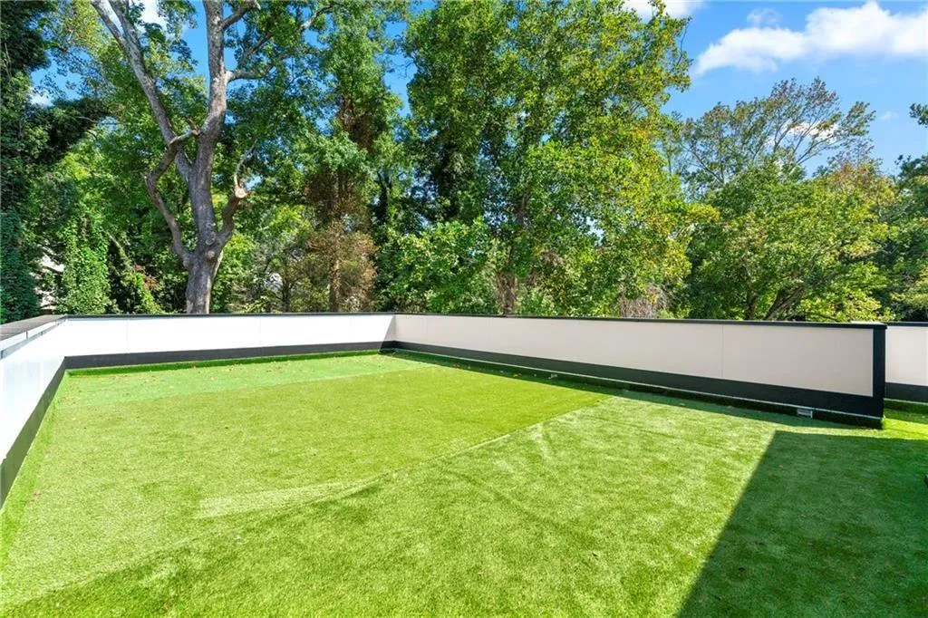 View of the private rooftop terrace in the back of home's third level View of the private rooftop terrace in the back of home's third level