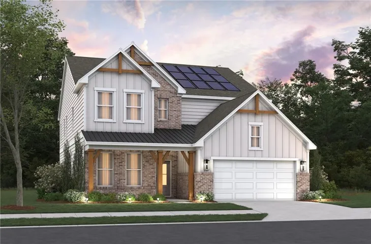 Modern farmhouse exterior featuring board and batten siding, stone accents, and a two-car garage