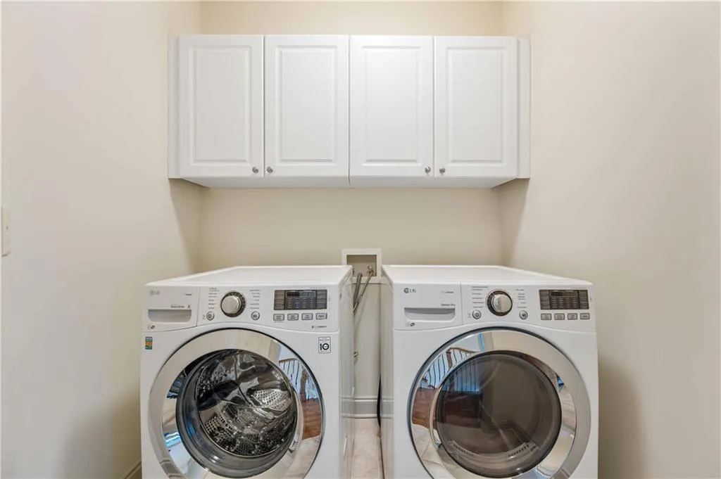 Tons of storage in this spacious laundry room which is located upstairs alongside the bedrooms
