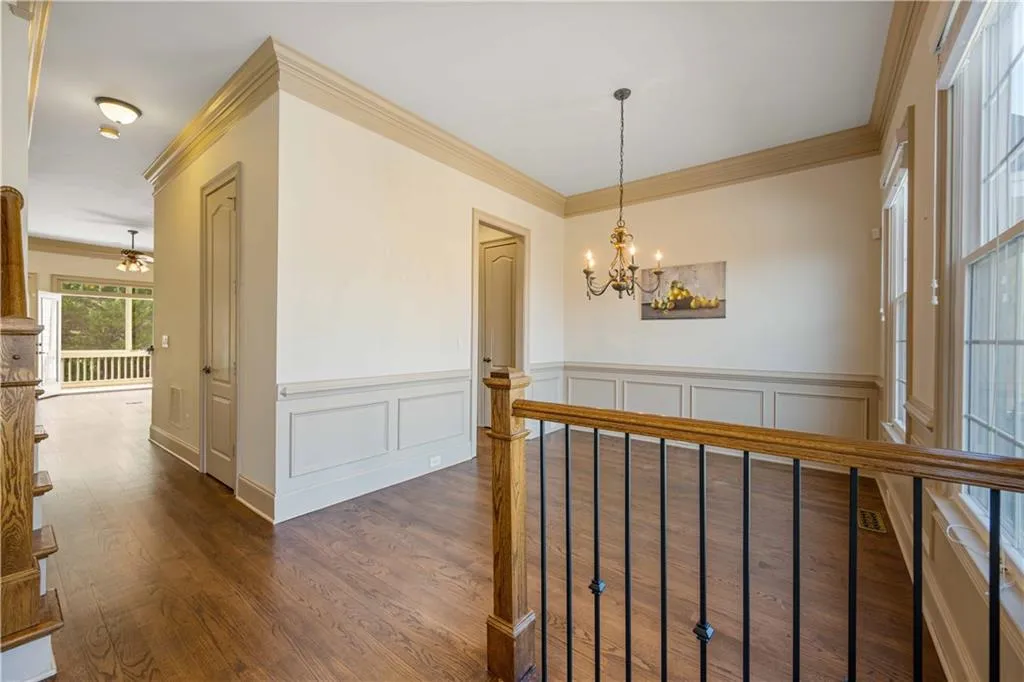Hardwood floors and crown moulding throughout the home. The wonderful flow takes you right out to the covered and screened in deck