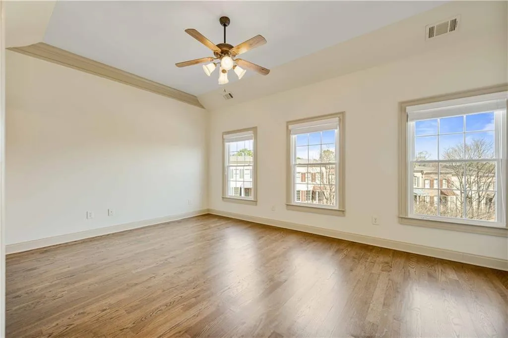 Secondary bedroom with new hardwood floors and tons of natural daylight! This second bedroom also has an ensuite and 2 closets!