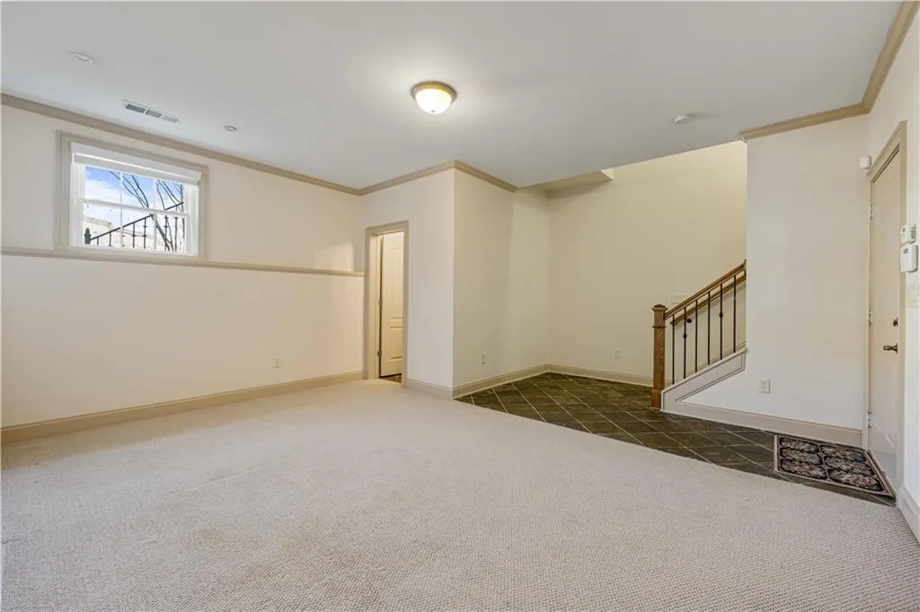 Wait, there is even more  space! Check out this finished basement which could also work as a bedroom! This space has its own full bathroom and a window that opens for air/access if needed. Once again, all the windows are new!