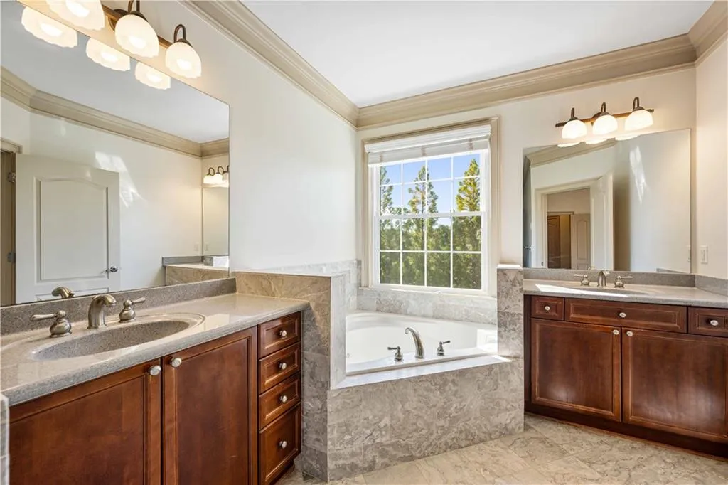 Separate vanities and a jetted tub makes life sweeter! Lots of room to move about while getting ready or after wrapping up the day!