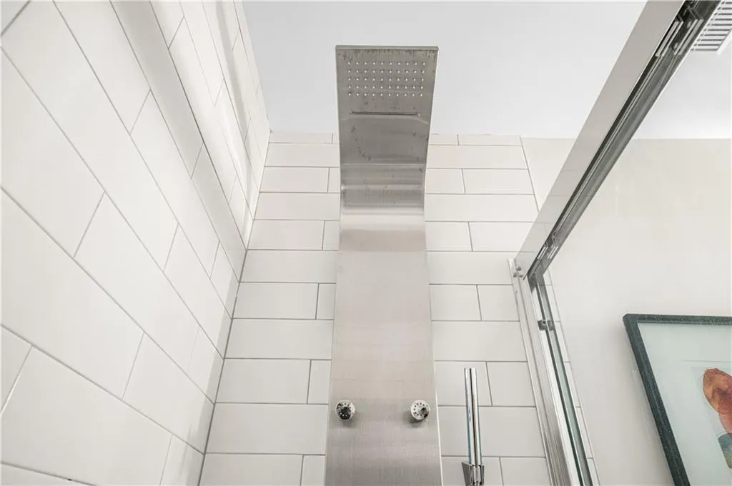 Bathroom view of a tile shower