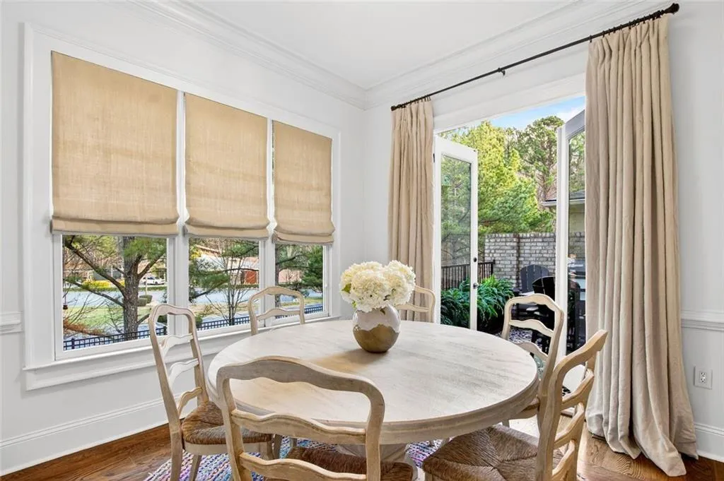 Sunroom with double doors leading to rear deck