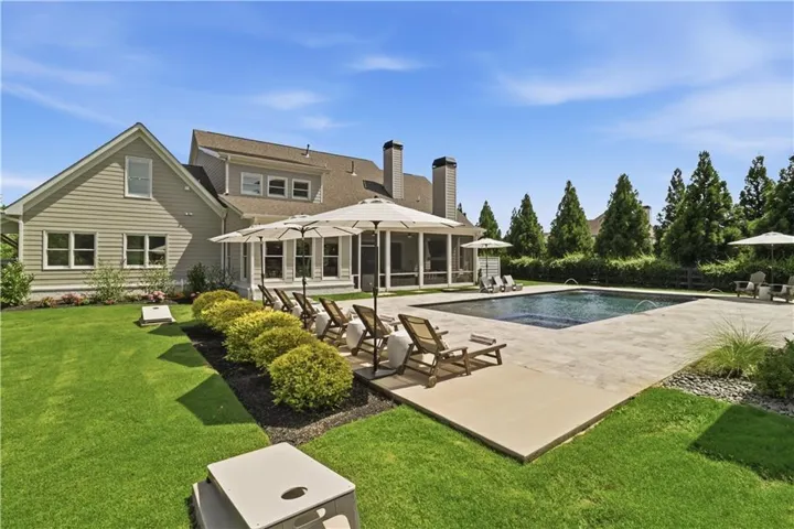 Salt water pool with integrated spa. Expansive sunning deck.