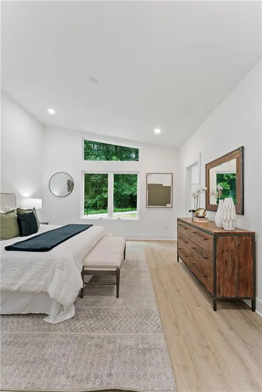 Bedroom featuring light wood-style floors and recessed lighting