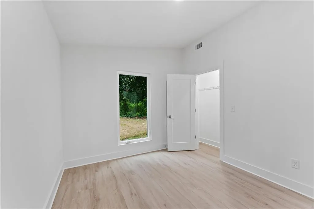 Empty room with light wood-type flooring