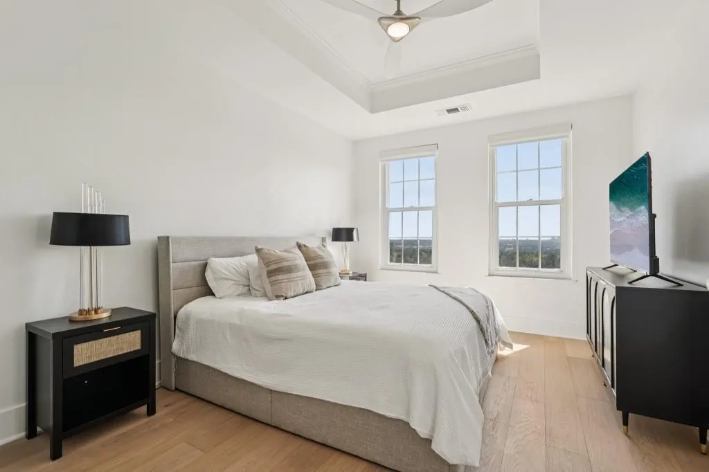Primary Suite With A Tray Ceiling, Walk-In Closet, & Spa-Style Ensuite