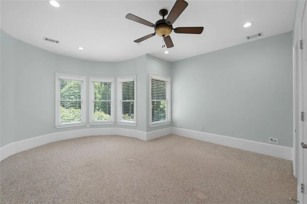 Guest bedroom 1 w/ walk-in closet & ensuite bath