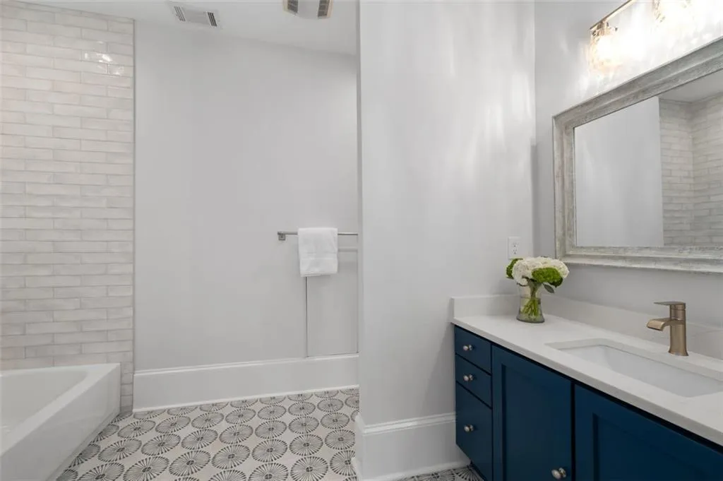 Fully renovated guest bath 2 is very large & has a linen closet