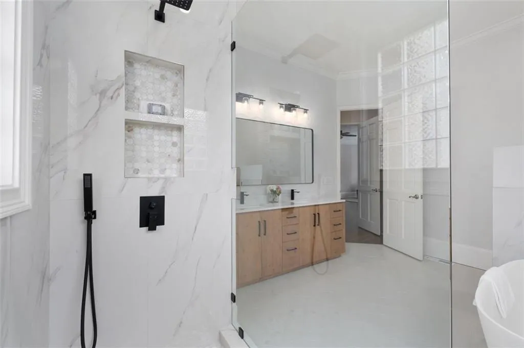 Stunning tile details throughout this newly renovated bathroom