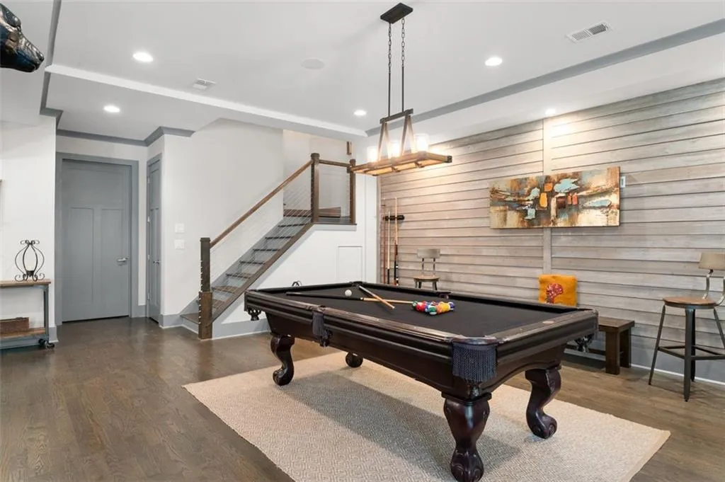 Shiplap detailed wall, high-ceilings & tons of natural light in the terrace level