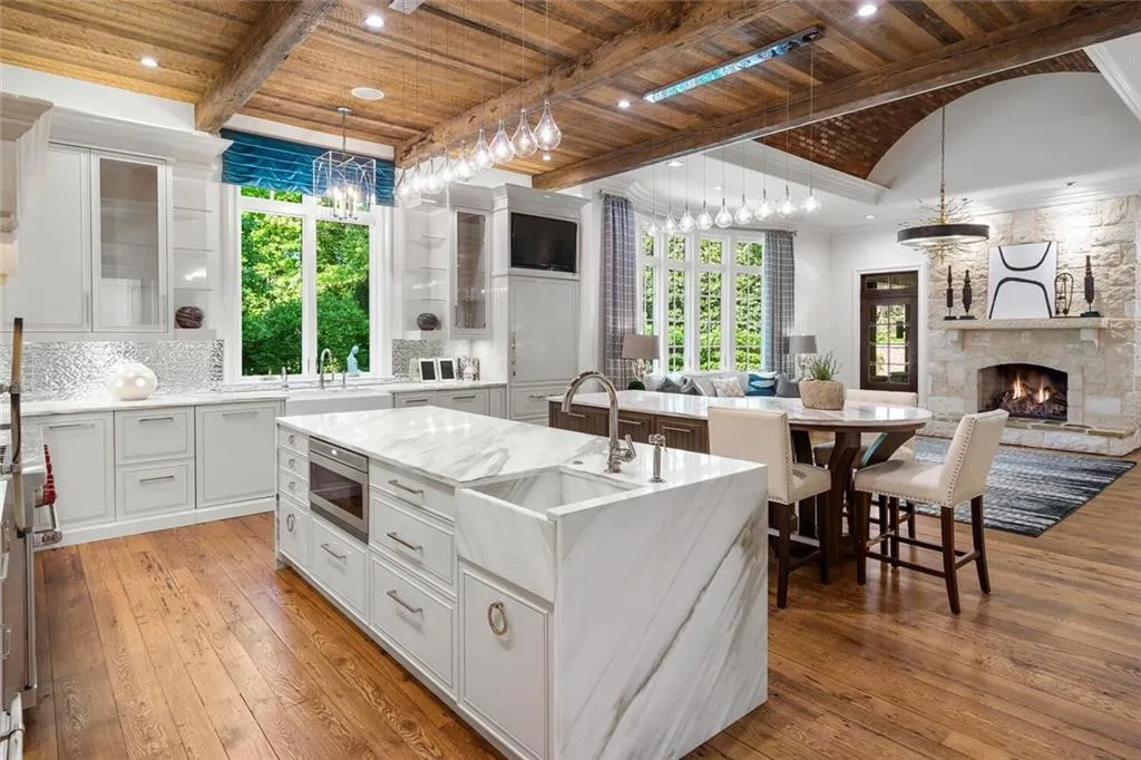 Redone kitchen. Custom cabinets by Karpaty. Fresh new design. Open to family room with masonry fireplace.