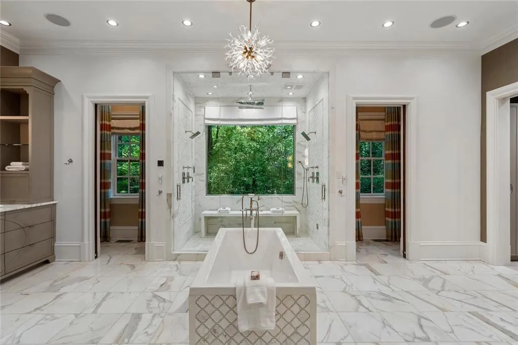 Heated floors, 2 water closets, 2 dressing rooms. Steam shower, motorized blind. Custom cabinetry.