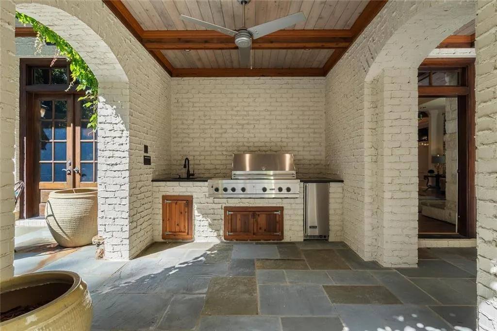Covered loggia with fireplace.