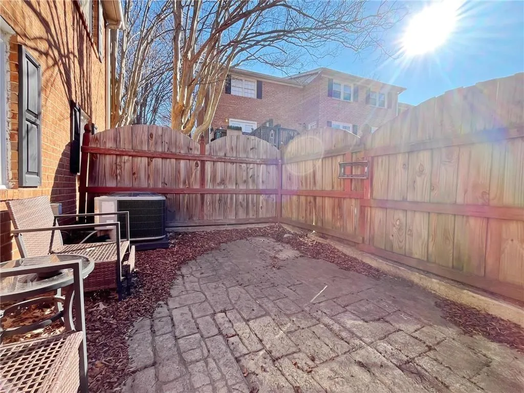Fenced backyard featuring a patio