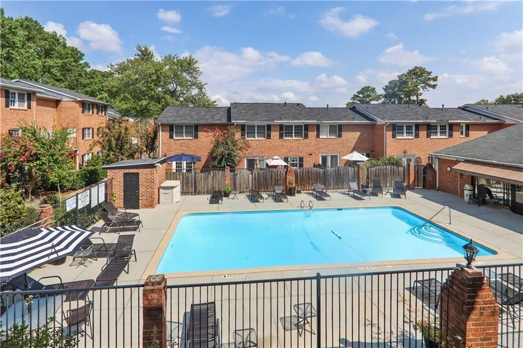 Community pool with a patio