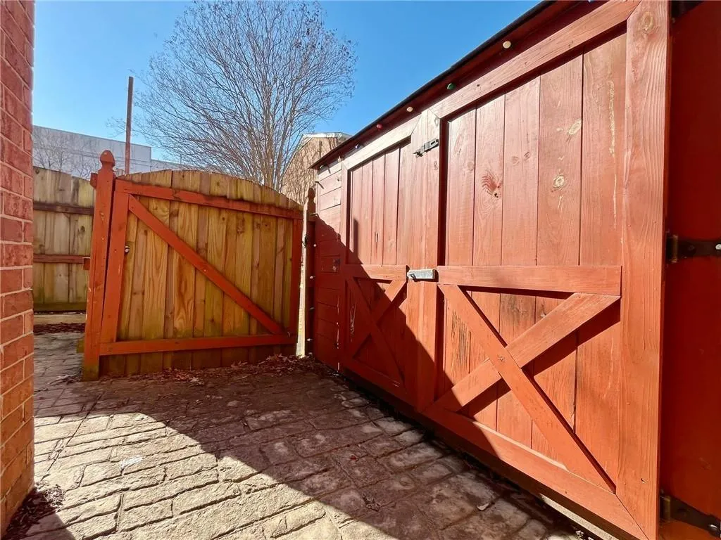 Gate featuring a storage unit