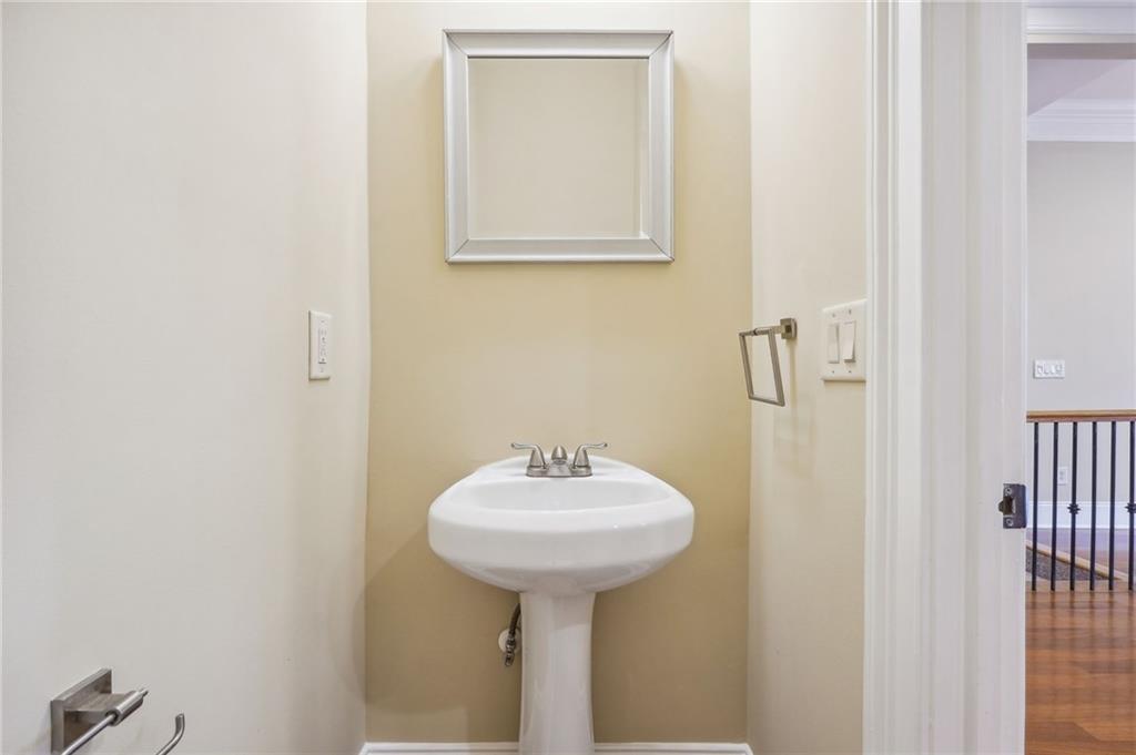 Bathroom with hardwood / wood-style floors