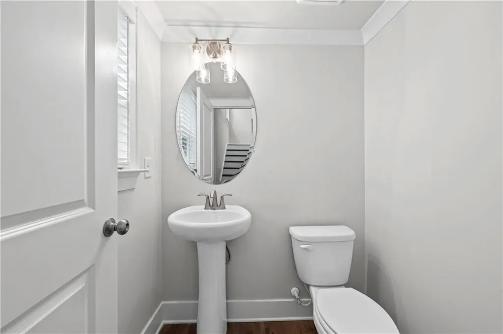 Main level powder room, up 3 stairs from main level offers ultimate privacy