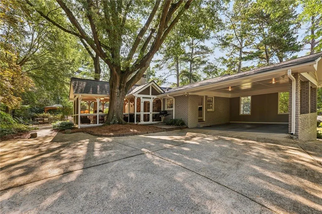 Second driveway to carport